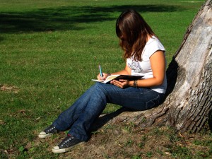 writing in diary under tree 300x225 Start a Free Online Diary, Journal or Blog... For Fun!